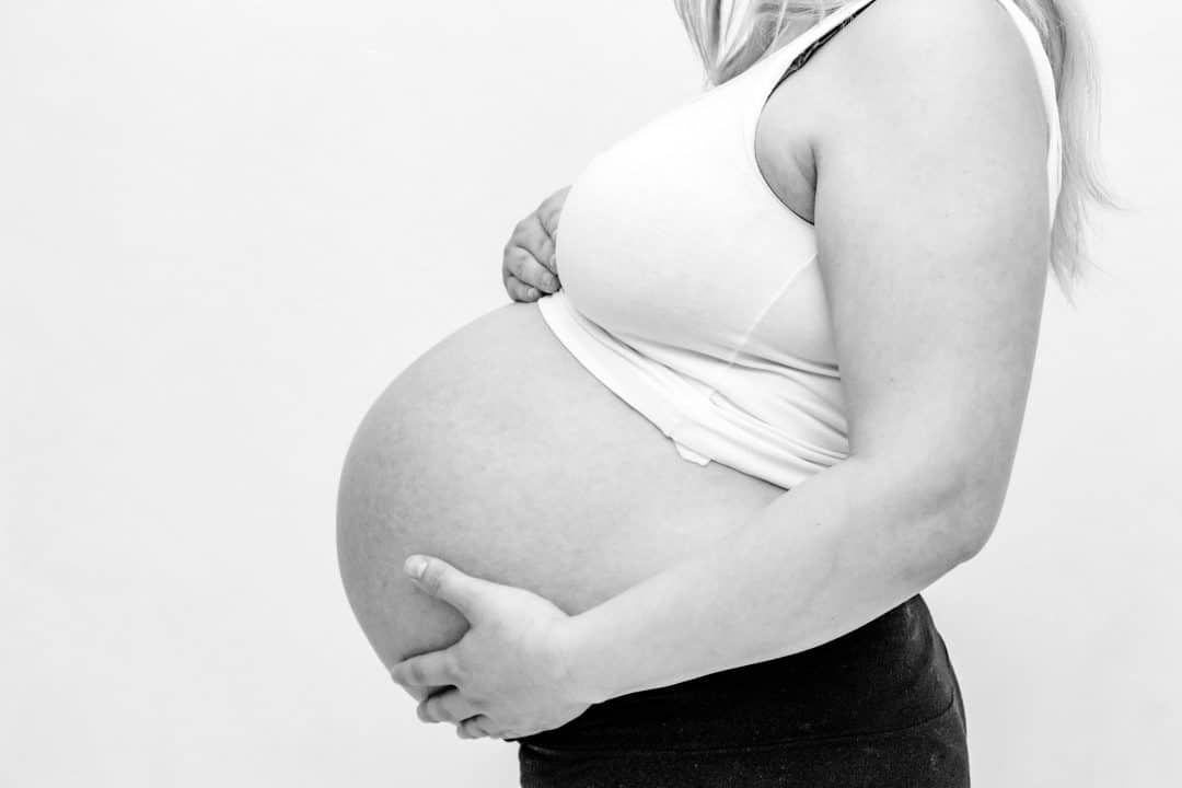 Woman holding her pregnant belly - Can I have Children If I Am Insulin Resistant