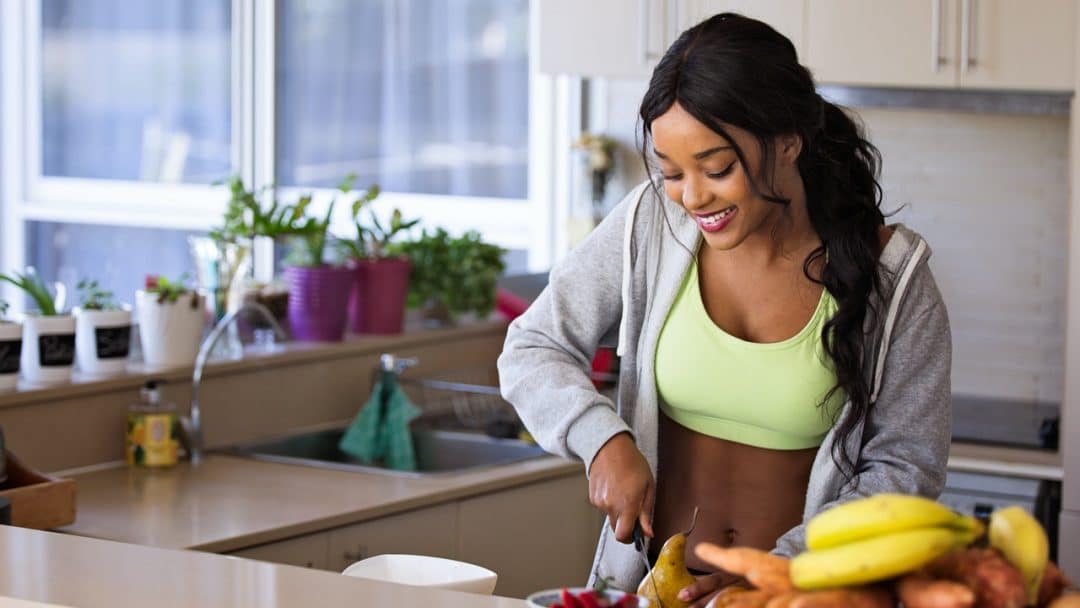 Woman making a healthy meal - Reversing Insulin Resistance with Lifestyle Changes