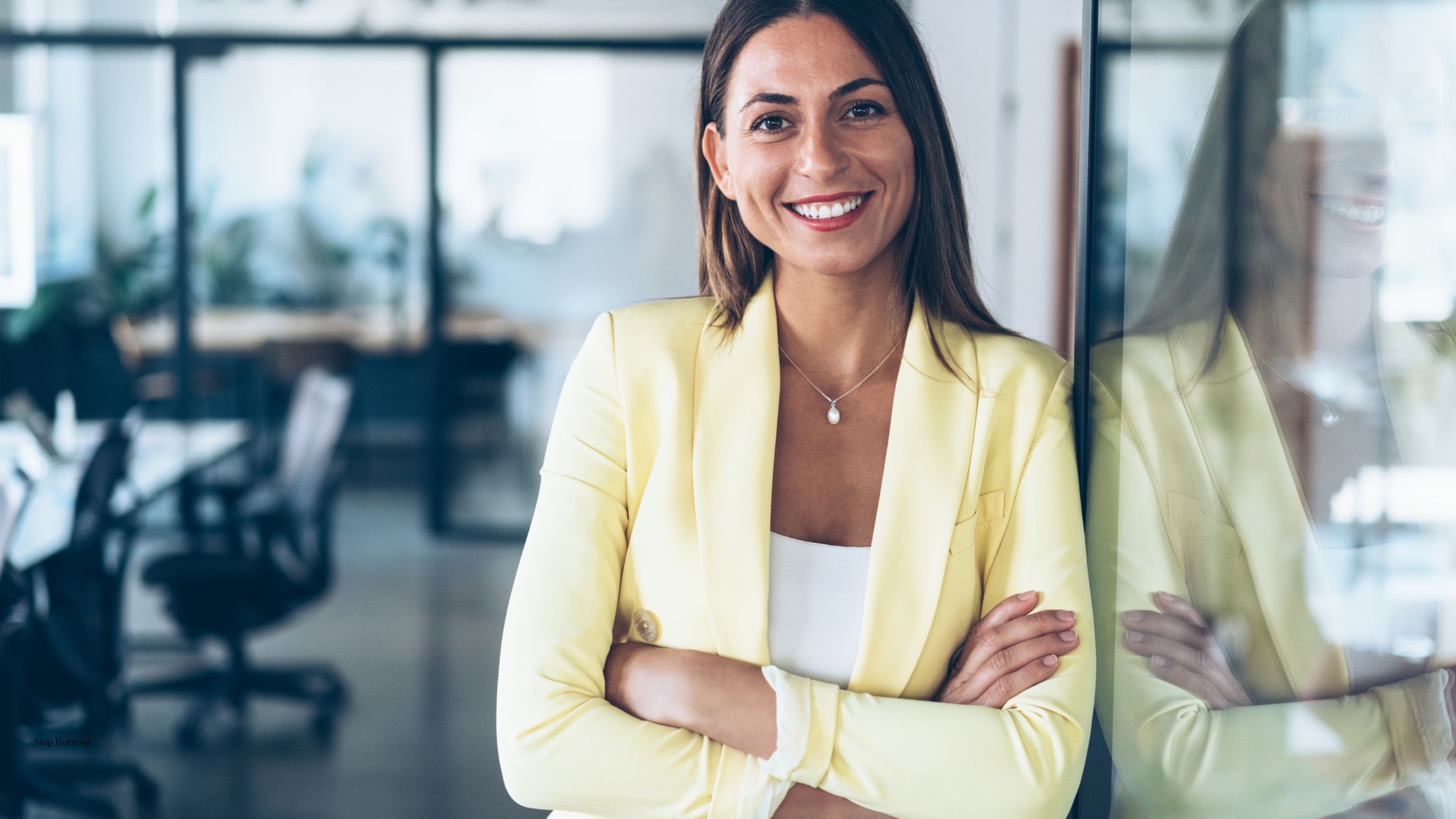 a woman smiling at camera in an office setting