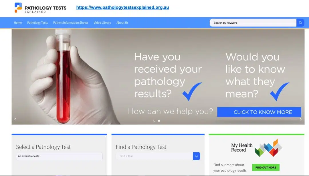 a hand holding a bottle with blood test sample